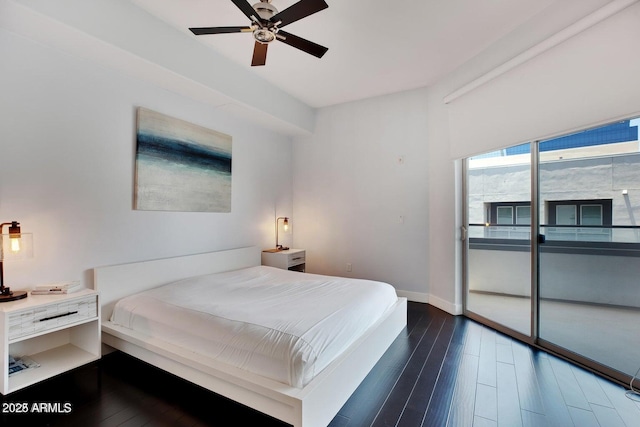 bedroom featuring dark wood finished floors, access to outside, a ceiling fan, and baseboards