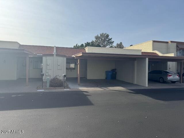 exterior space with a carport