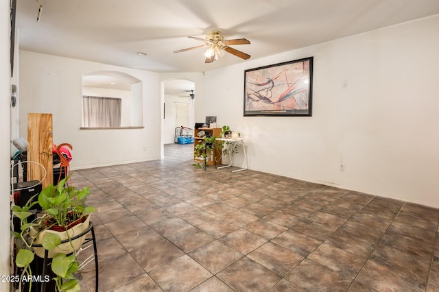 2721 N 107th Dr, Avondale, AZ 85392 - spare room featuring a ceiling fan and arched walkways
