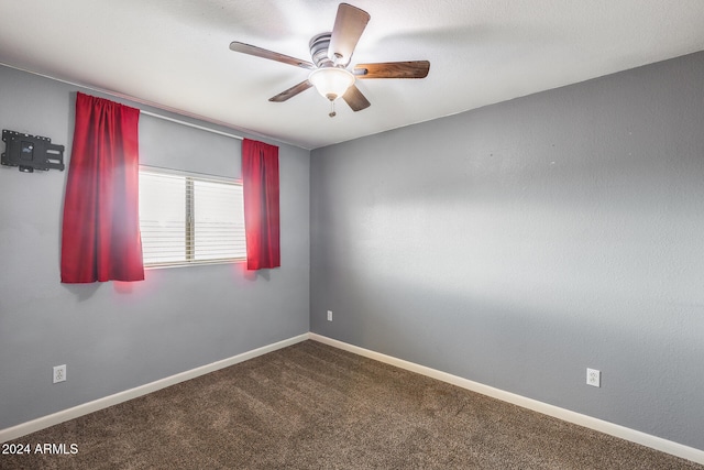 spare room with ceiling fan and carpet floors