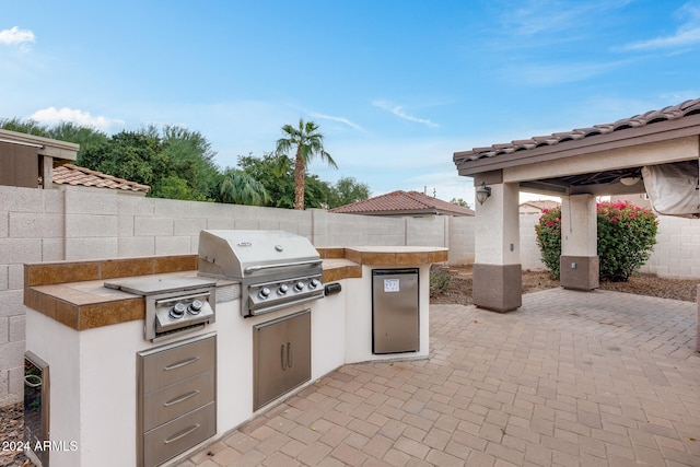 view of patio / terrace featuring a grill and area for grilling