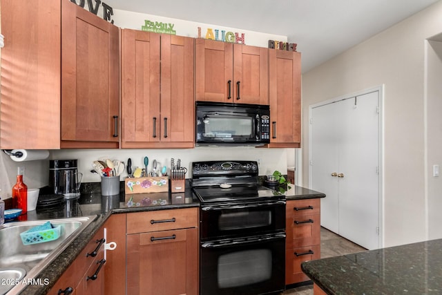 40904 N Hearst Dr, Anthem, AZ 85086 - kitchen featuring black appliances, dark stone counters, brown cabinetry, and a sink