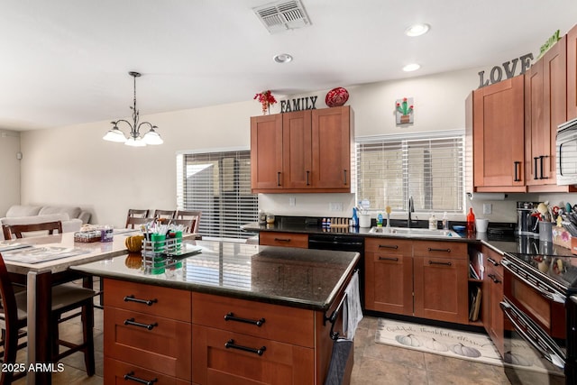 40904 N Hearst Dr, Anthem, AZ 85086 - kitchen with visible vents, recessed lighting, an inviting chandelier, black appliances, and a sink