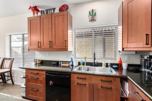 40904 N Hearst Dr, Anthem, AZ 85086 - kitchen featuring baseboards, dishwasher, dark stone counters, brown cabinets, and a sink