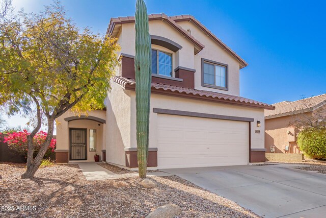 40904 N Hearst Dr, Anthem, AZ 85086 - mediterranean / spanish house with a tile roof, a garage, driveway, and stucco siding