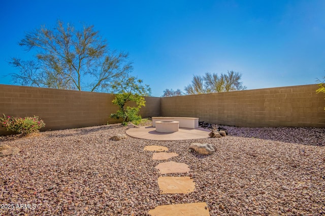 40904 N Hearst Dr, Anthem, AZ 85086 - view of yard with a patio, a fenced backyard, and an outdoor fire pit
