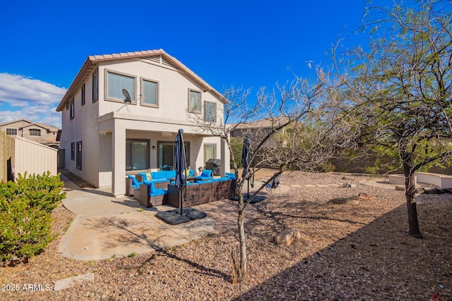40904 N Hearst Dr, Anthem, AZ 85086 - rear view of property featuring an outdoor living space, stucco siding, a patio, and fence