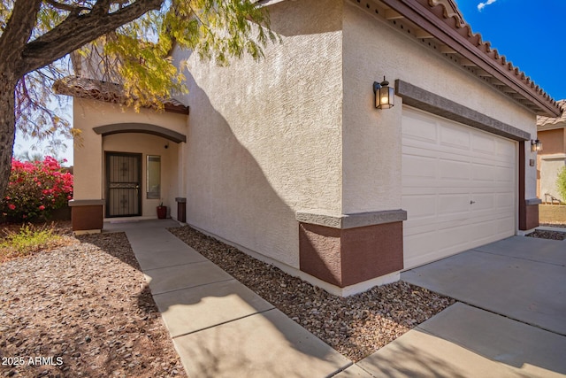 40904 N Hearst Dr, Anthem, AZ 85086 - view of front of property with driveway and stucco siding