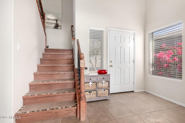 40904 N Hearst Dr, Anthem, AZ 85086 - stairs featuring tile patterned floors and baseboards