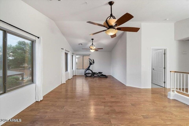 interior space featuring wood-type flooring and high vaulted ceiling