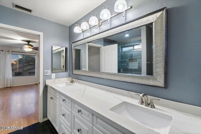 bathroom featuring tile patterned floors and vanity