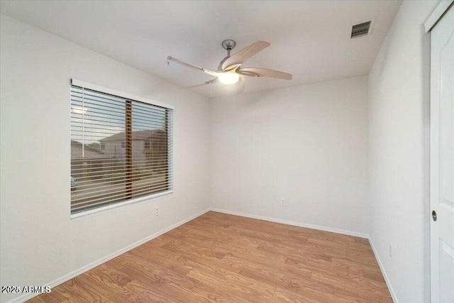 spare room featuring ceiling fan and light wood-type flooring