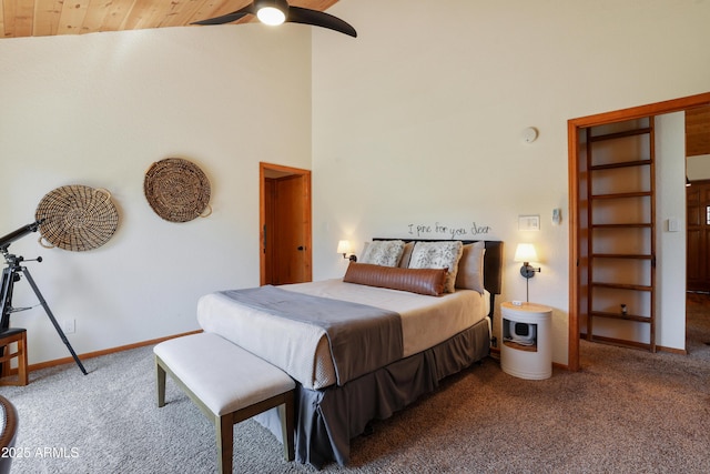 bedroom featuring high vaulted ceiling, carpet flooring, a ceiling fan, wood ceiling, and baseboards