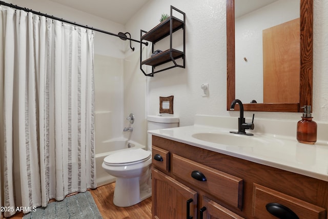 bathroom with vanity, wood finished floors, toilet, and shower / tub combo with curtain