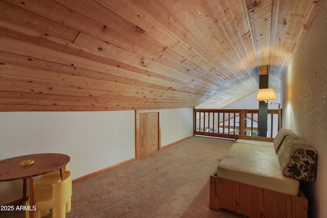 bonus room with baseboards, a textured wall, lofted ceiling, wooden ceiling, and carpet flooring