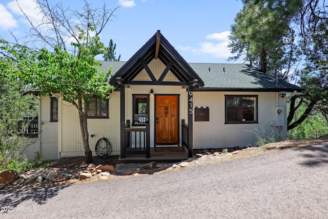 view of front of house with a shingled roof