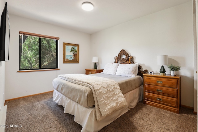 carpeted bedroom featuring baseboards