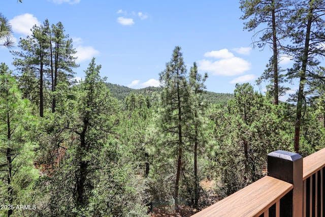 mountain view featuring a view of trees