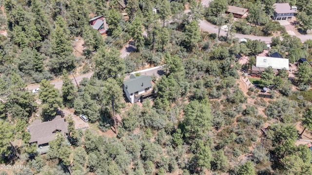 drone / aerial view with a view of trees