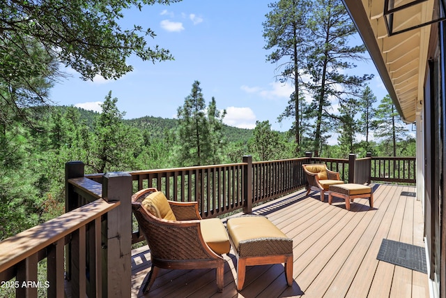 deck featuring a wooded view