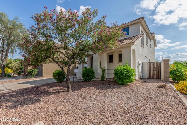 4135 E Waterman Ct, Gilbert, AZ 85297 - view of front of home featuring stucco siding, a tiled roof, a gate, and fence