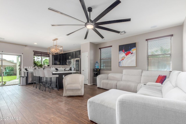 4135 E Waterman Ct, Gilbert, AZ 85297 - living area with a chandelier, ceiling fan, wood finished floors, and recessed lighting