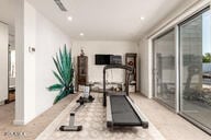exercise room featuring recessed lighting