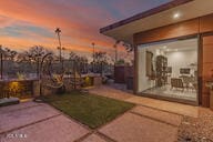 yard at dusk featuring a patio area