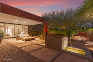 view of patio terrace at dusk