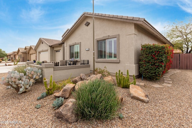 view of side of property featuring a garage