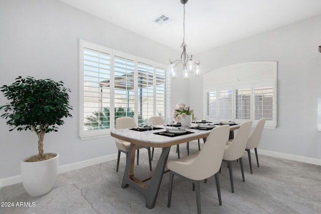 dining room featuring a chandelier