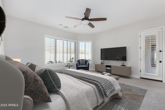 carpeted bedroom with access to exterior and ceiling fan