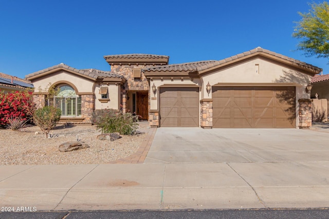 mediterranean / spanish-style home featuring a garage