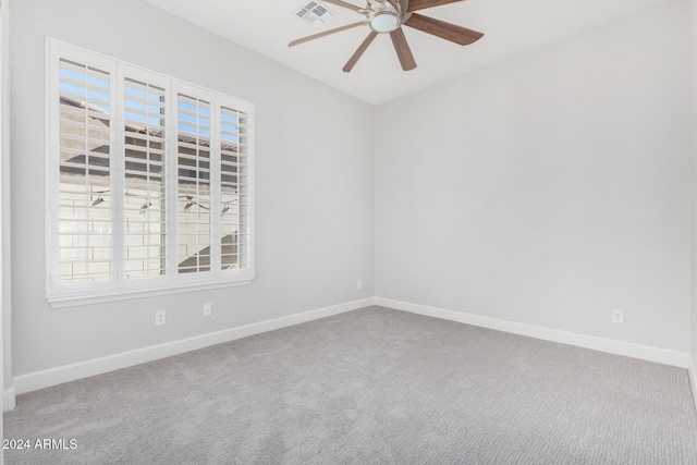 unfurnished room featuring carpet and ceiling fan