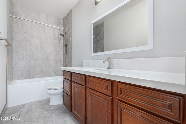 full bathroom featuring vanity, toilet, and tiled shower / bath