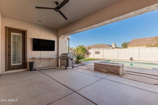 view of patio / terrace featuring a fenced in pool, grilling area, and ceiling fan