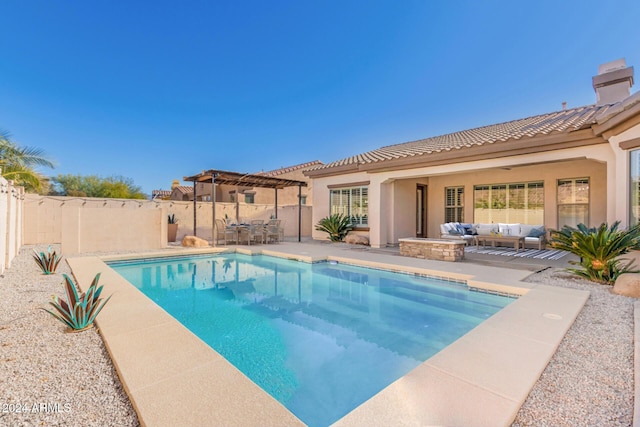 view of pool with an outdoor living space, a patio area, and a pergola