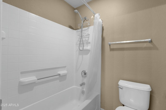 bathroom with toilet and shower / bath combo