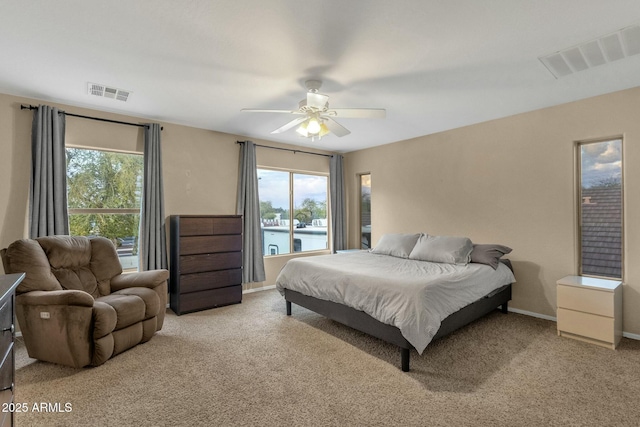 bedroom featuring visible vents, ceiling fan, baseboards, and carpet