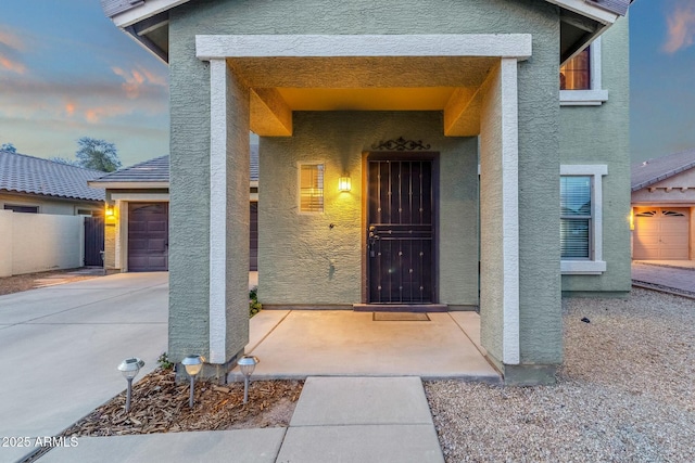 property entrance featuring stucco siding