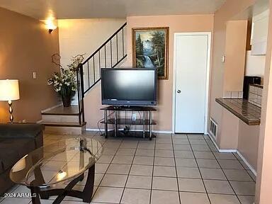 living room featuring light tile patterned floors