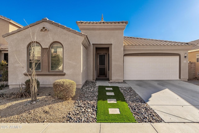 mediterranean / spanish-style home with a garage