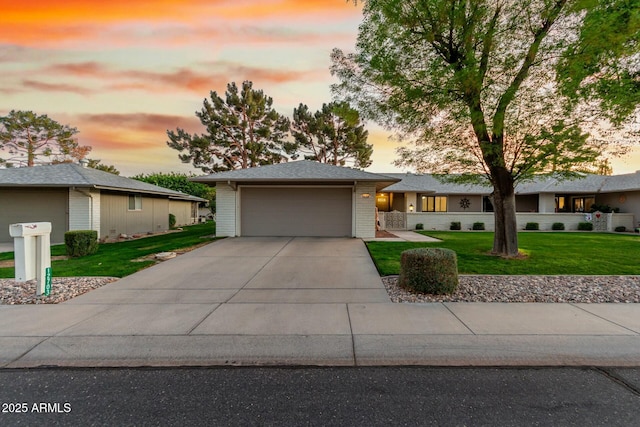 view of front of property featuring driveway, an attached garage, a front yard, and brick siding