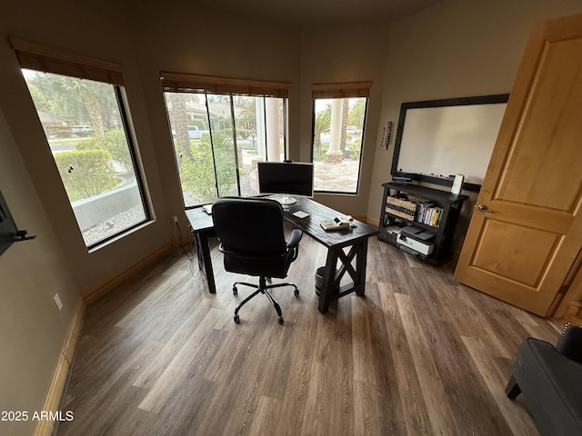 office space featuring wood finished floors and baseboards