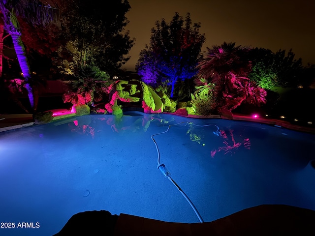 690 E Seattle Slew Ln, Gilbert, AZ 85296 - pool at twilight featuring an outdoor pool