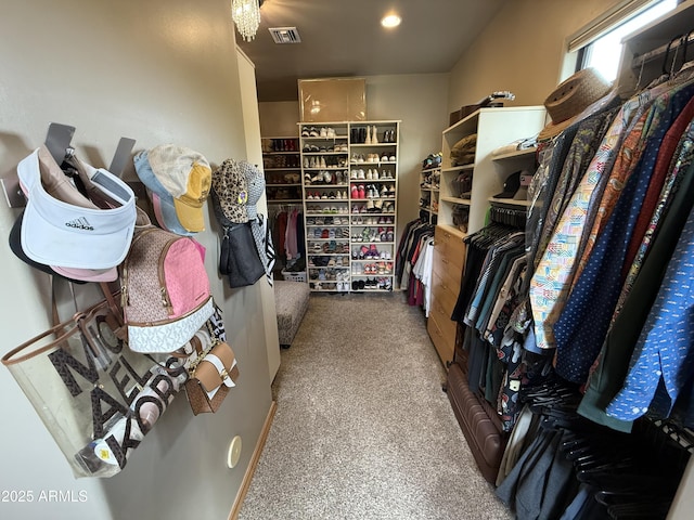 spacious closet featuring visible vents and carpet