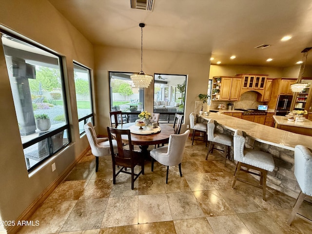 dining room with a notable chandelier, visible vents, recessed lighting, and baseboards