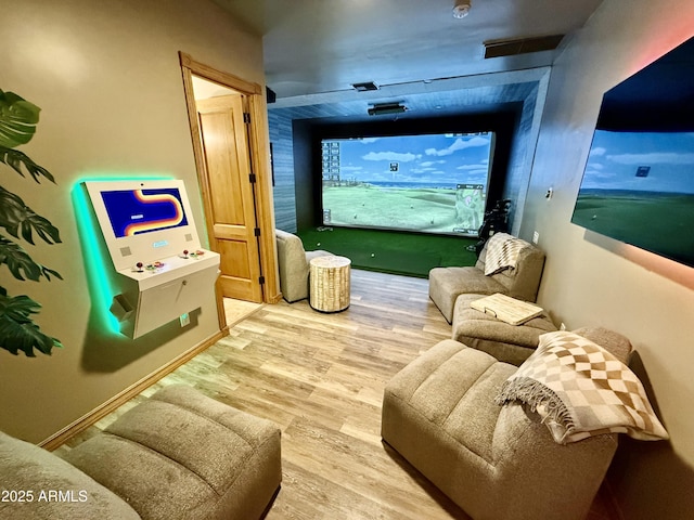 corridor with baseboards and wood finished floors