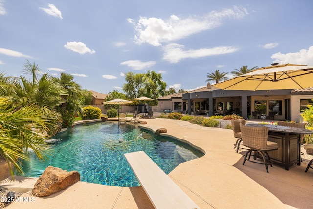 690 E Seattle Slew Ln, Gilbert, AZ 85296 - swimming pool with a patio area and a diving board