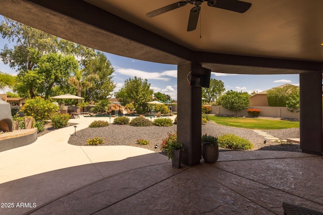 690 E Seattle Slew Ln, Gilbert, AZ 85296 - fenced backyard featuring a patio area, a ceiling fan, and a swimming pool